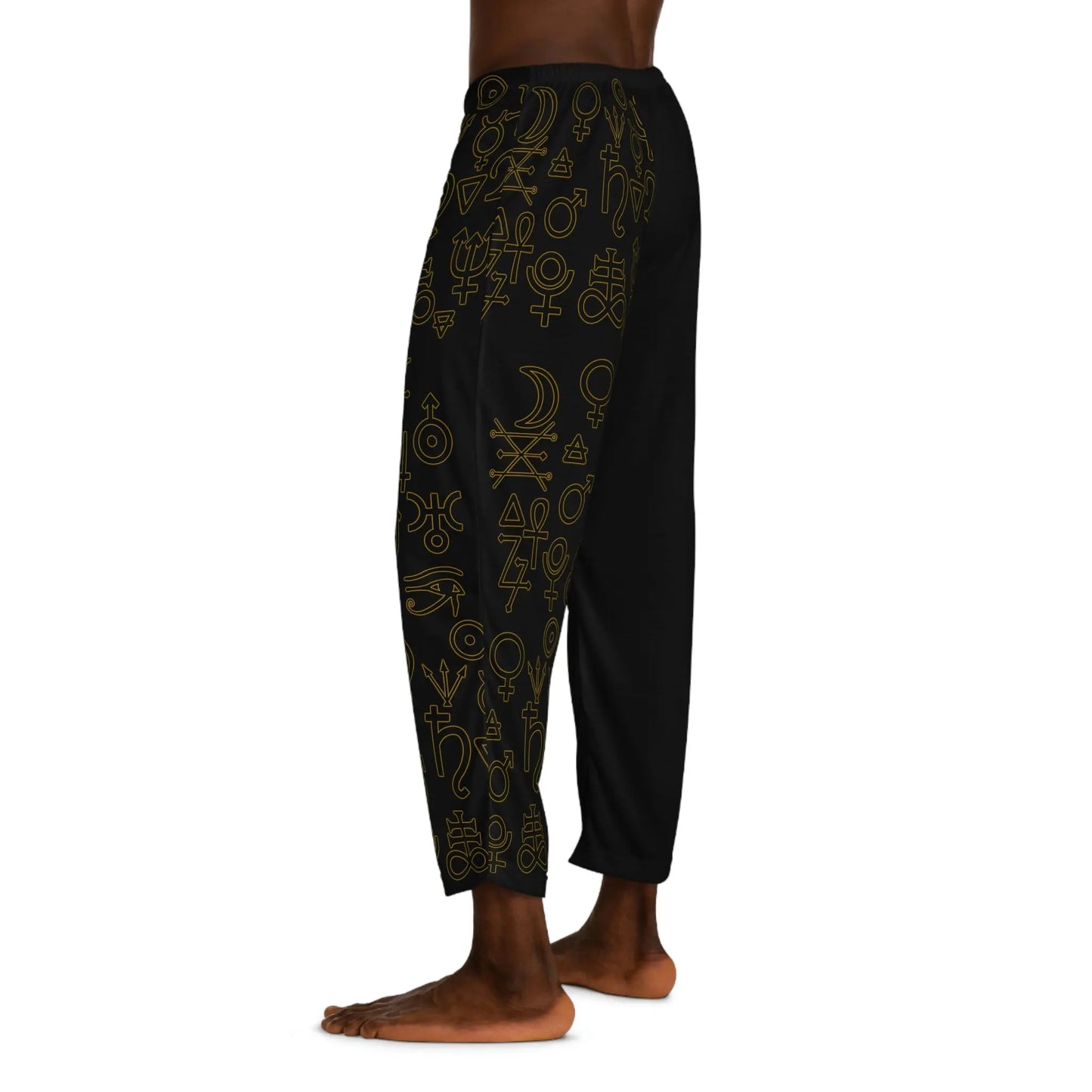 Model wearing the Alchemist Pajama Pants - Side view showing the detailed gold symbols.