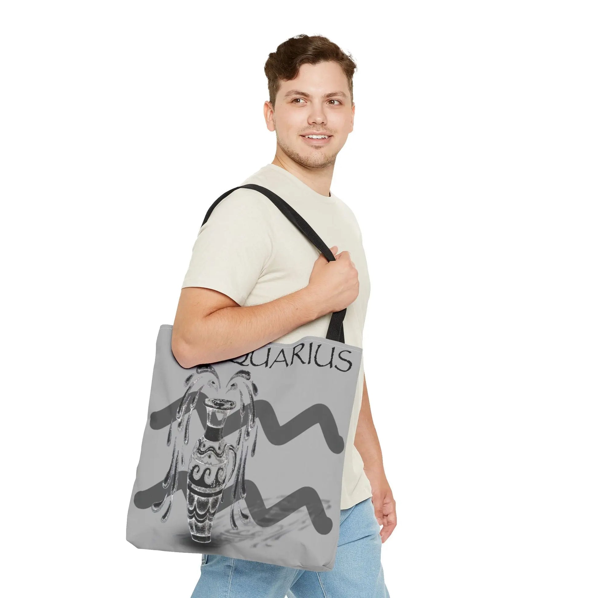 Man carrying the Aquarius Zodiac Tote Bag to show scale and style.