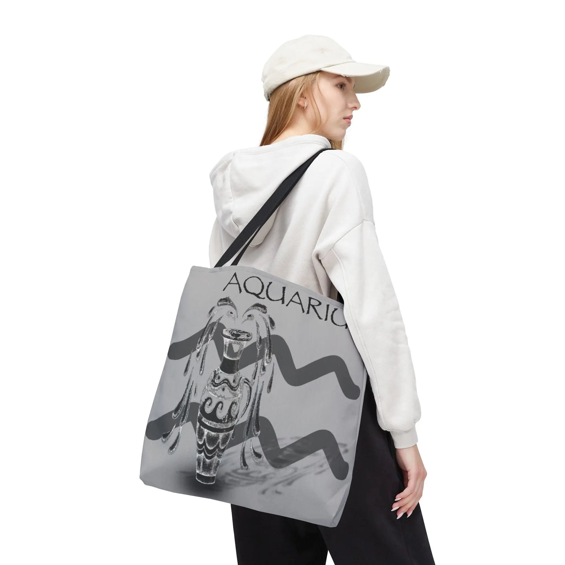 Woman carrying the Aquarius Zodiac Tote Bag over her shoulder.