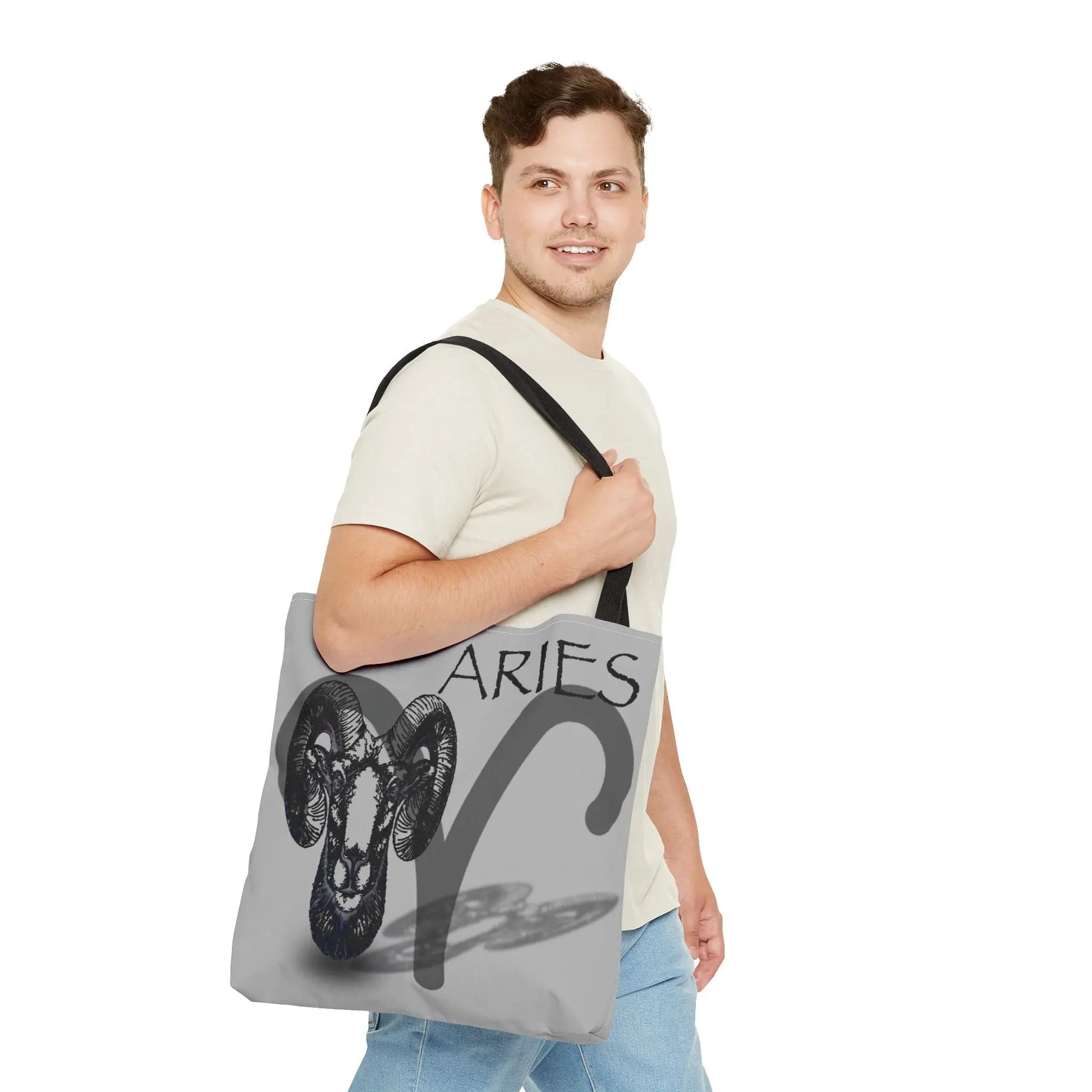 Man carrying the Aries Zodiac Tote Bag to show scale and style.