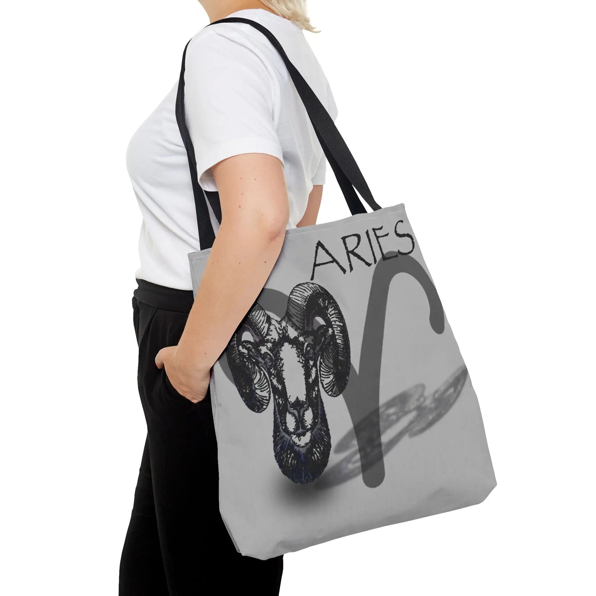 Woman carrying the Aries Zodiac Tote Bag over her shoulder.
