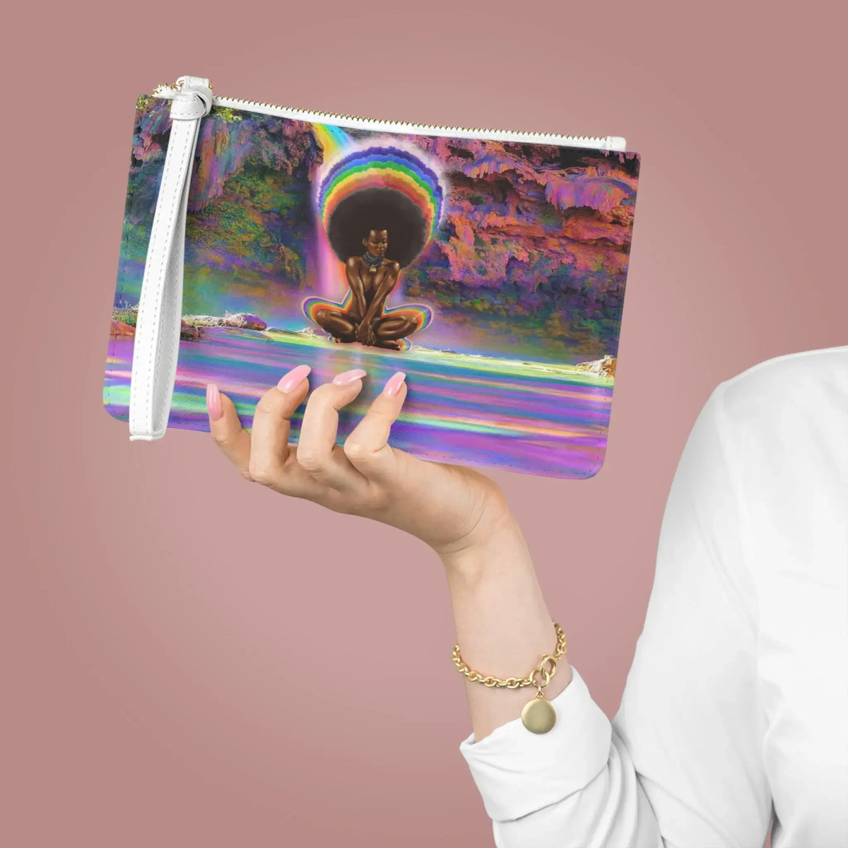 Hand holding vibrant chakra-themed pouch with meditating figure, rainbow aura, and cosmic design for spiritual energy.