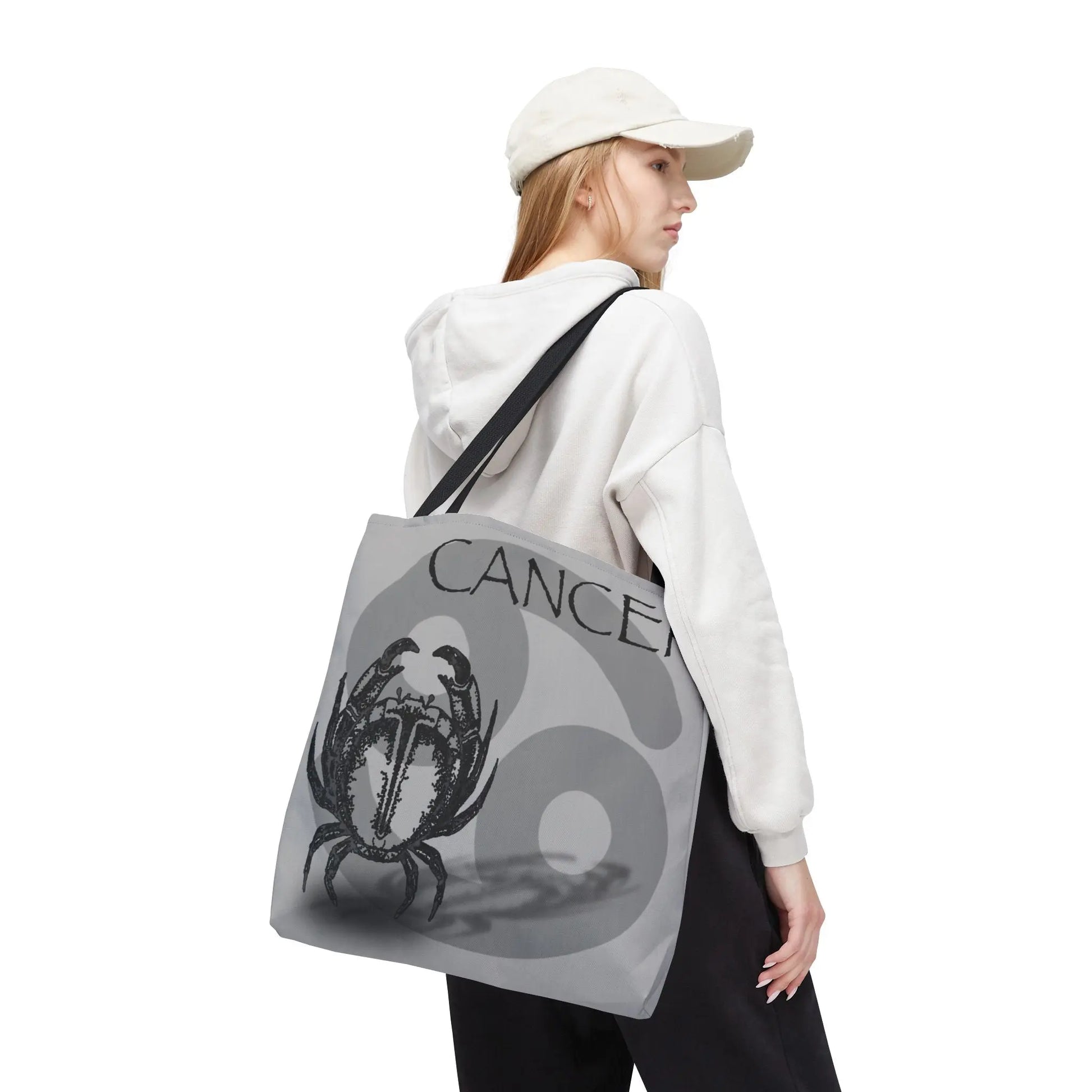 Woman carrying the Cancer Zodiac Tote Bag over her shoulder.