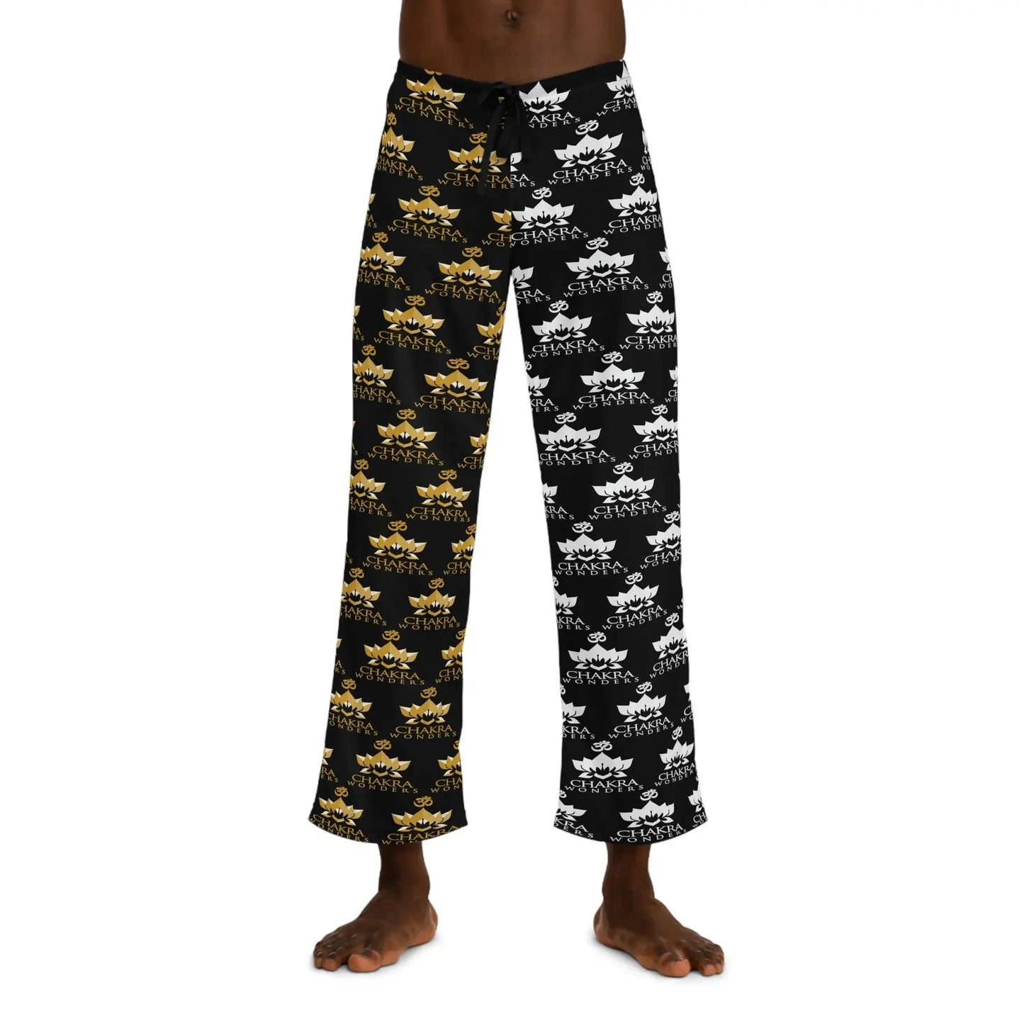 Black chakra pajama pants with gold and white lotus and om symbols, spiritual sleepwear for energy balance