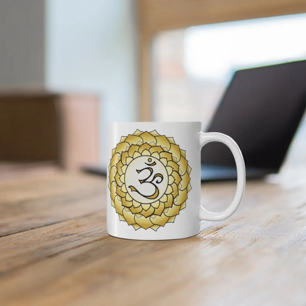Crown Chakra Mug - Symbol side shown on a wooden desk with a laptop.