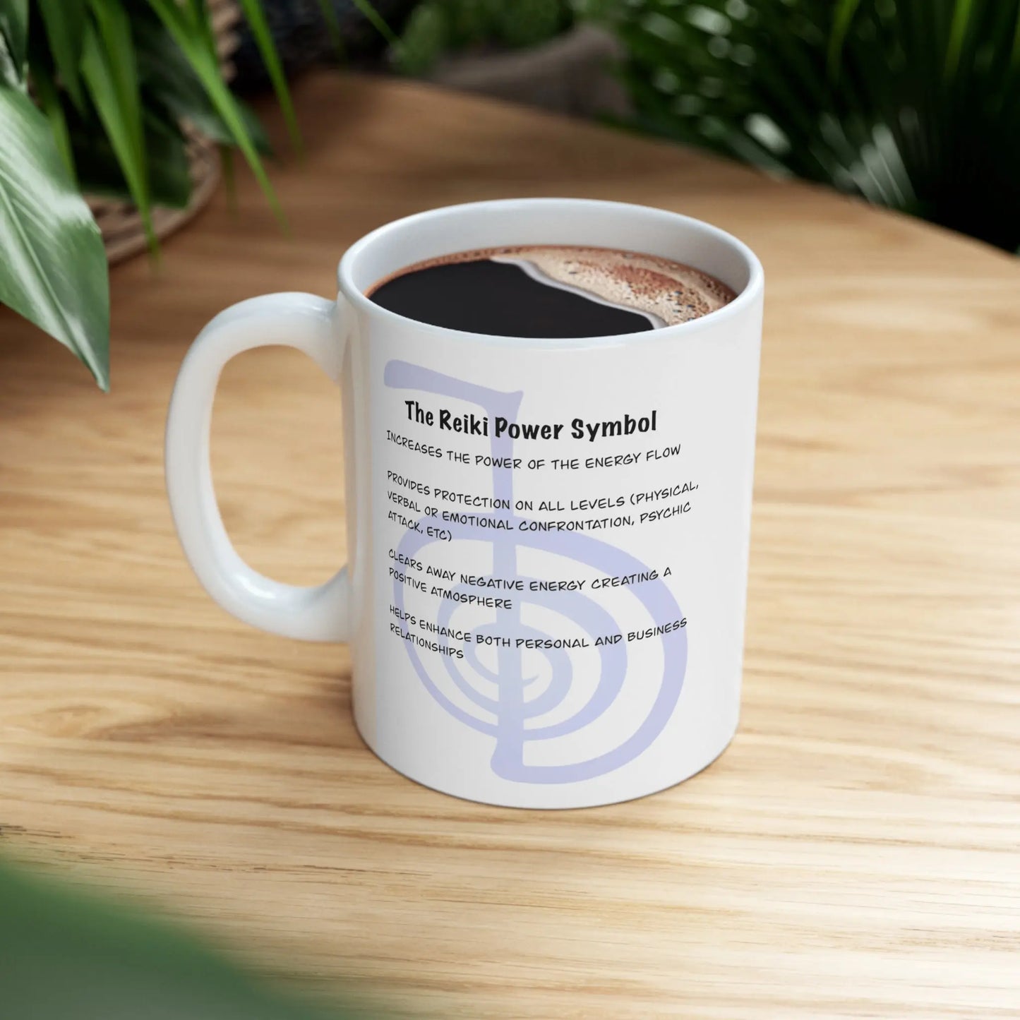 Cho Ku Rei Reiki Mug - Right side with Power Symbol description, on a counter with plants.