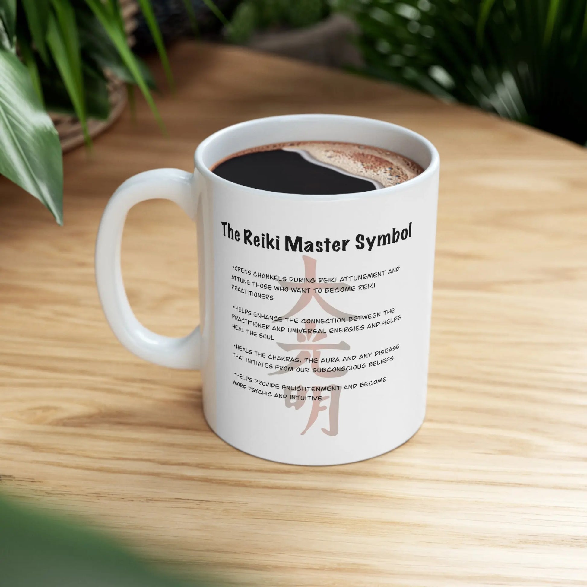 Dai Ko Myo Reiki Mug - Right side with Master Symbol description, on a counter with plants.
