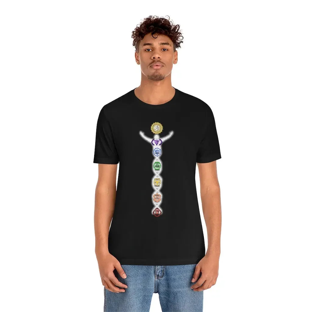 Man wearing black t-shirt with colorful chakra symbols aligned vertically for spiritual energy and mindfulness