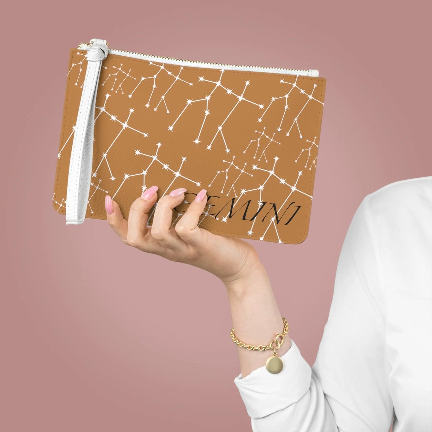 Large Gemini Zodiac Clutch held by a woman to show its scale.