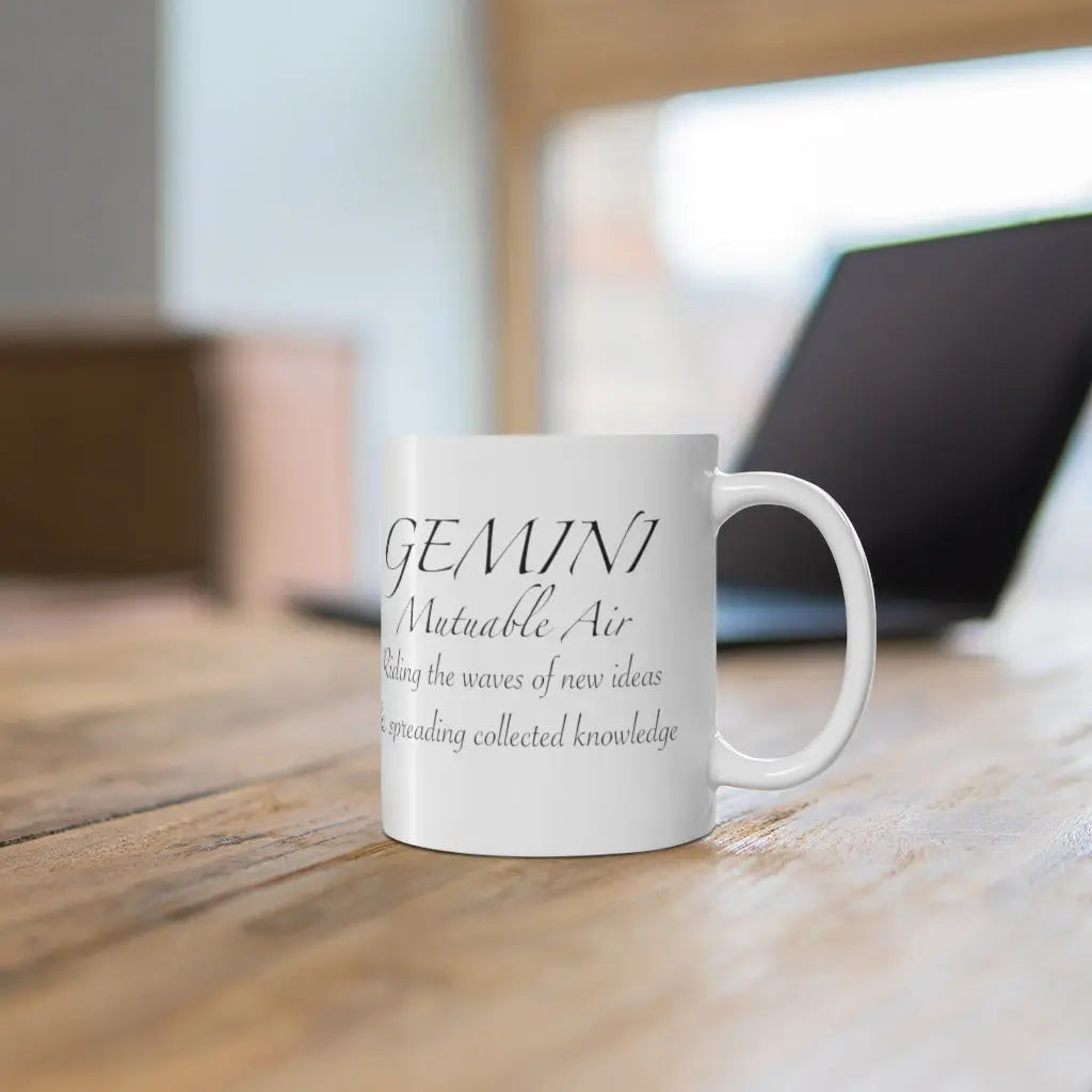 Gemini Zodiac Mug - Left side showing "Mutable Air" quote on a modern desk background.
