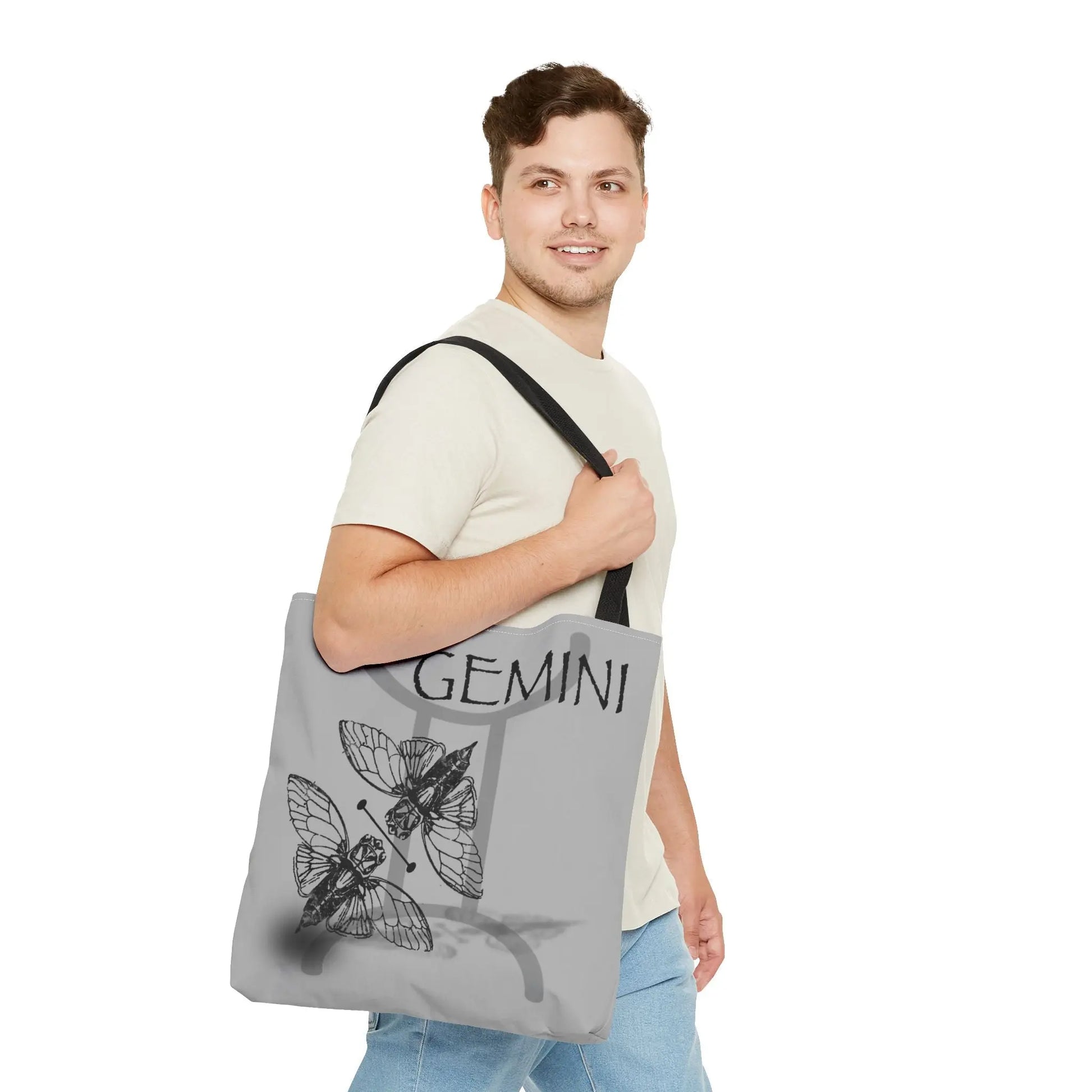 Man carrying the Gemini Zodiac Tote Bag to show scale and style.