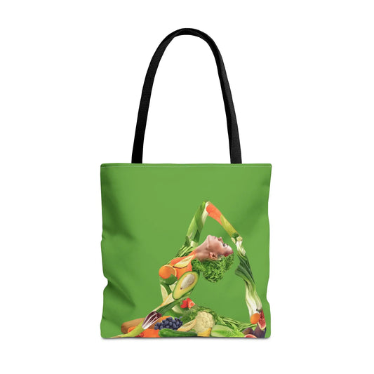 Vegan Yoga Goddess Tote Bag - Front view showing a woman in a yoga pose made of vegetables on a green canvas.