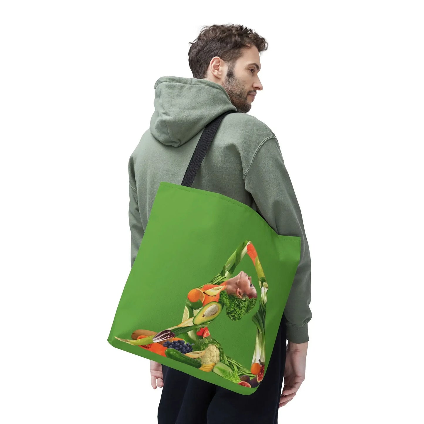 Green tote bag with vibrant fruit and veggie yoga pose design, perfect for holistic lifestyle lovers.