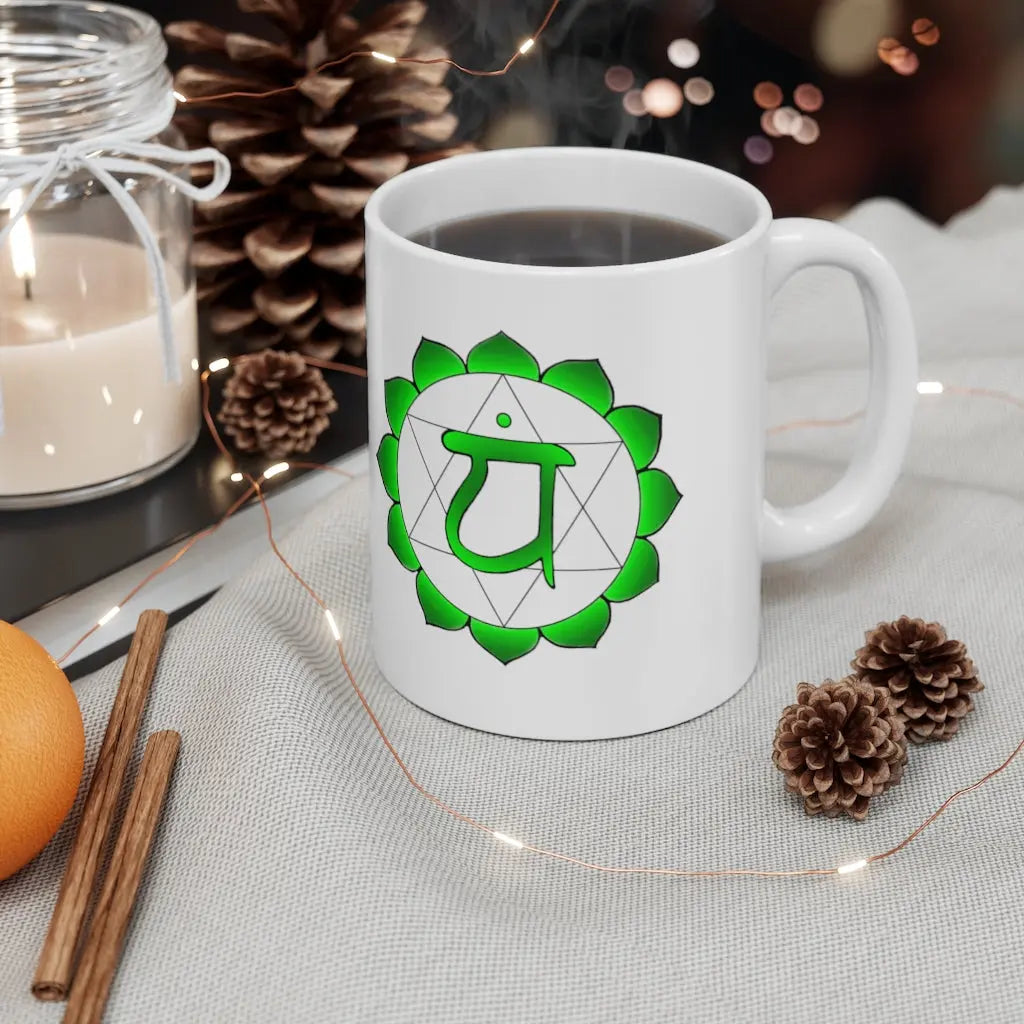 Heart Chakra Mug - Symbol side with a cozy, winter-themed background.