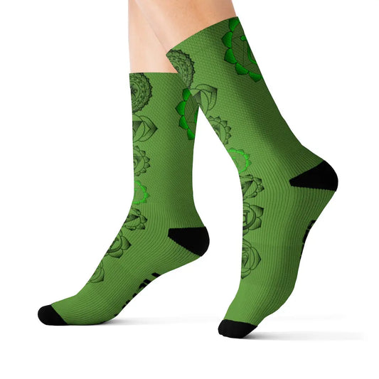 Model (White Background): Model wearing the green Heart Chakra Socks to showcase the fit and vibrant, loving design.