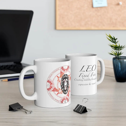 Two Leo Zodiac Mugs on a desk, showing both the quote side and the elemental sigil side.