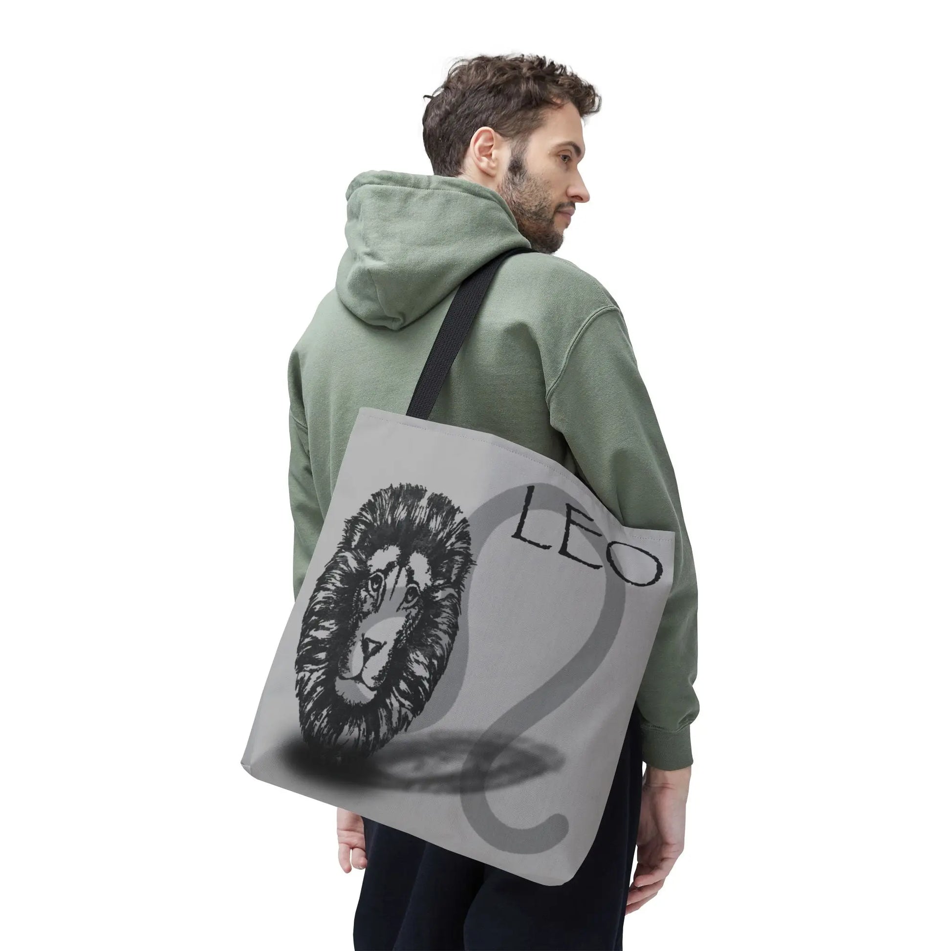 Man carrying the Leo Zodiac Tote Bag to show scale and style.