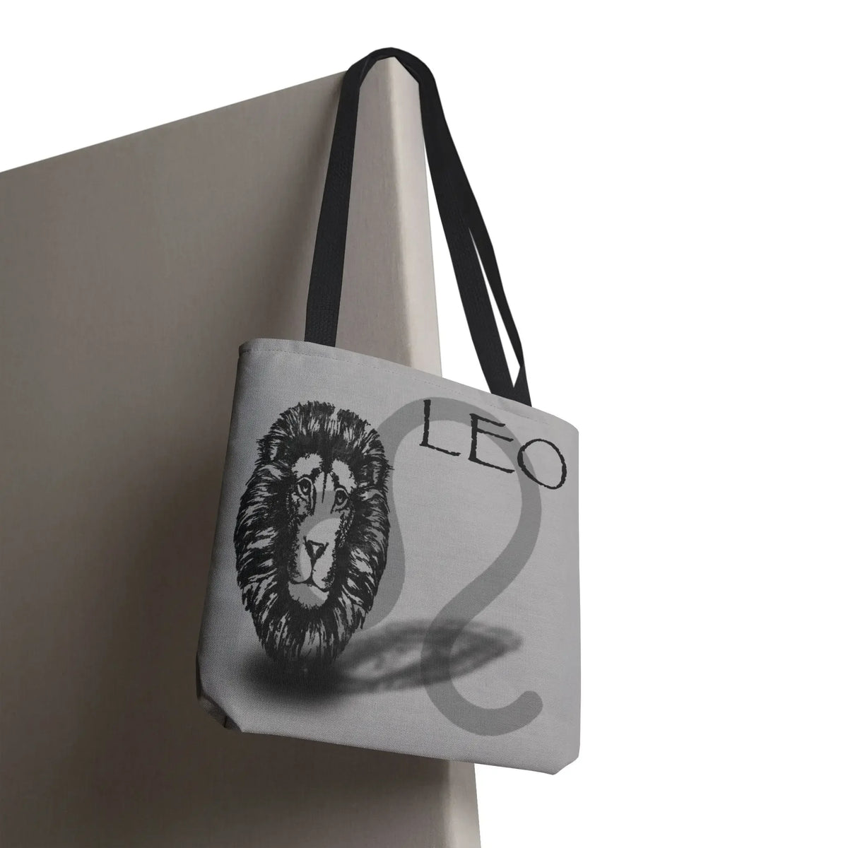 Gray tote bag with Leo zodiac lion design and black straps, perfect for astrology lovers