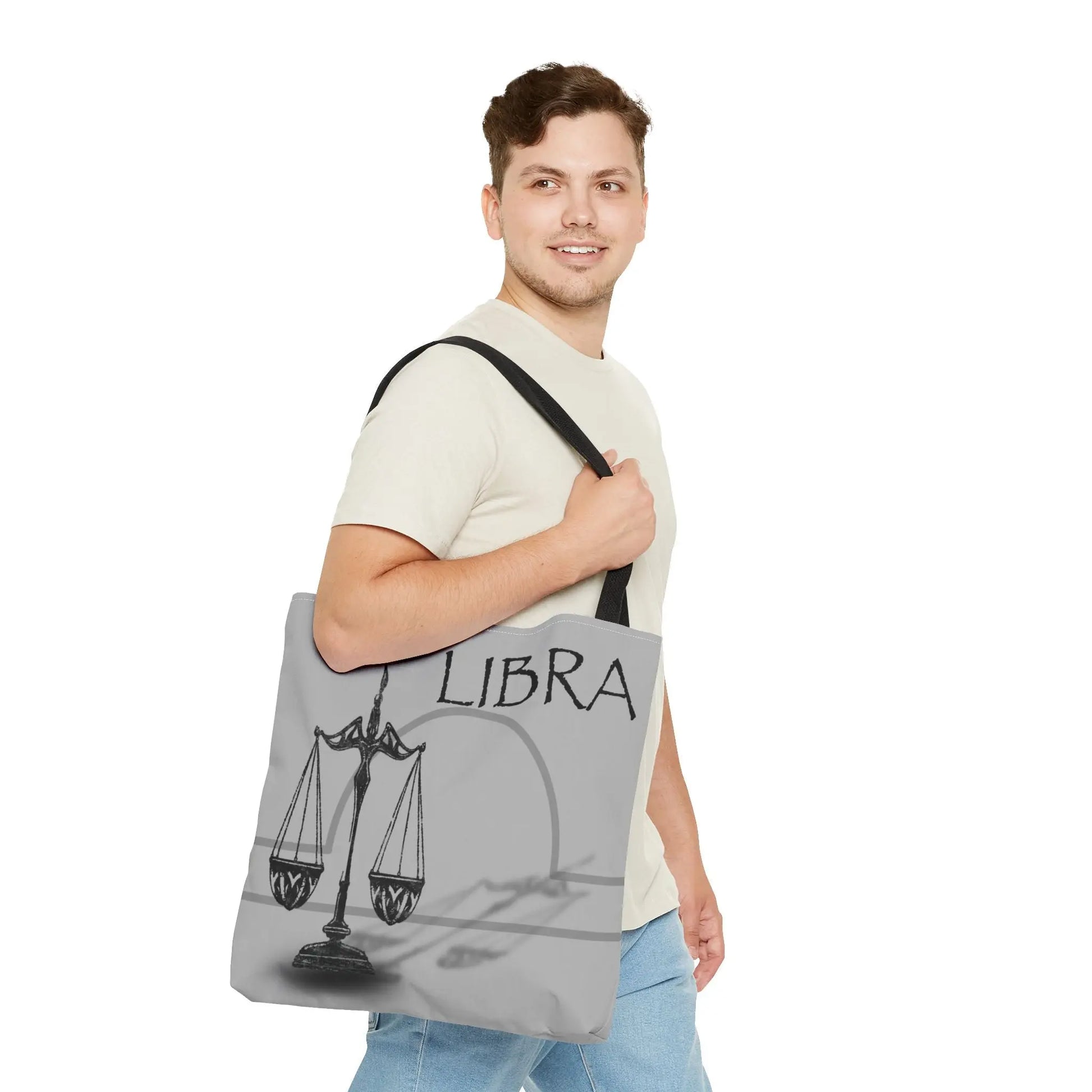 Man carrying the Libra Zodiac Tote Bag to show scale and style.