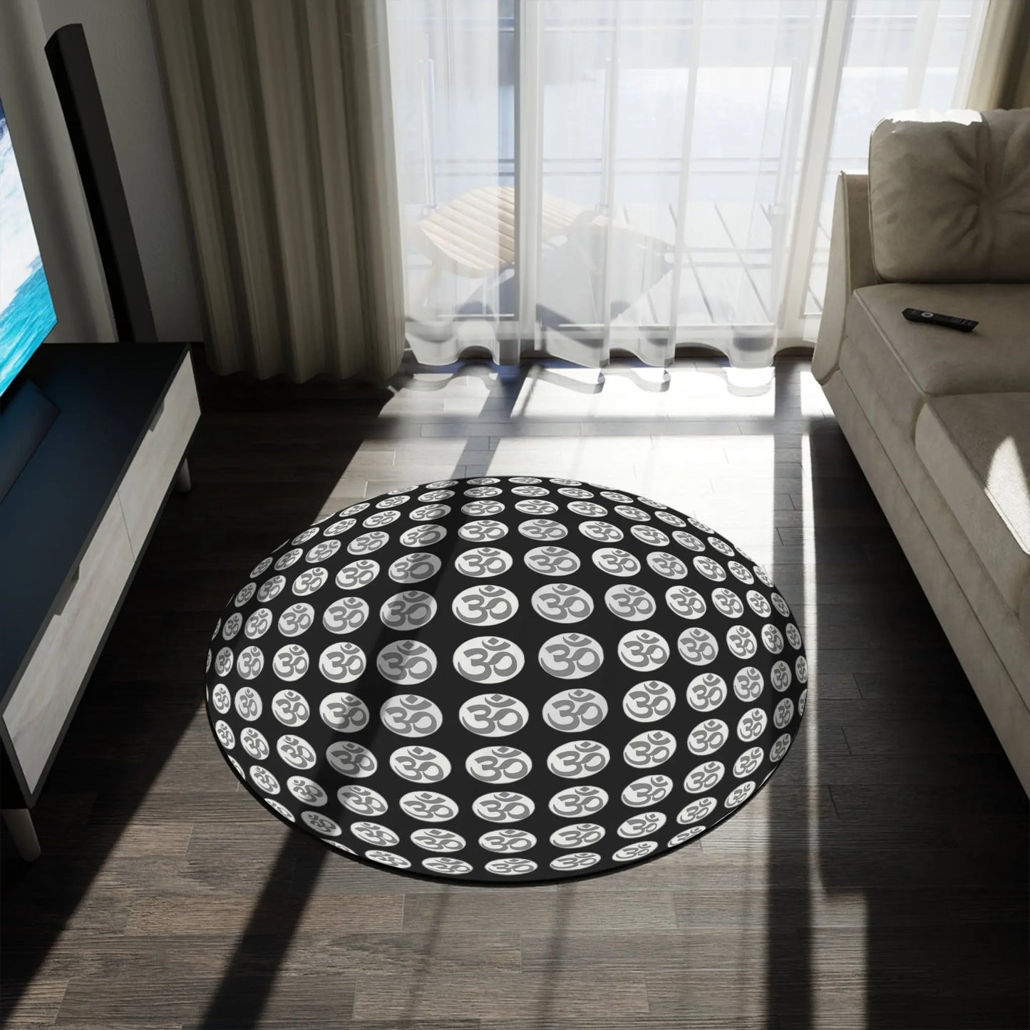 The 60x60" "OM Symbol" Rug shown in a modern living room next to a sofa.
