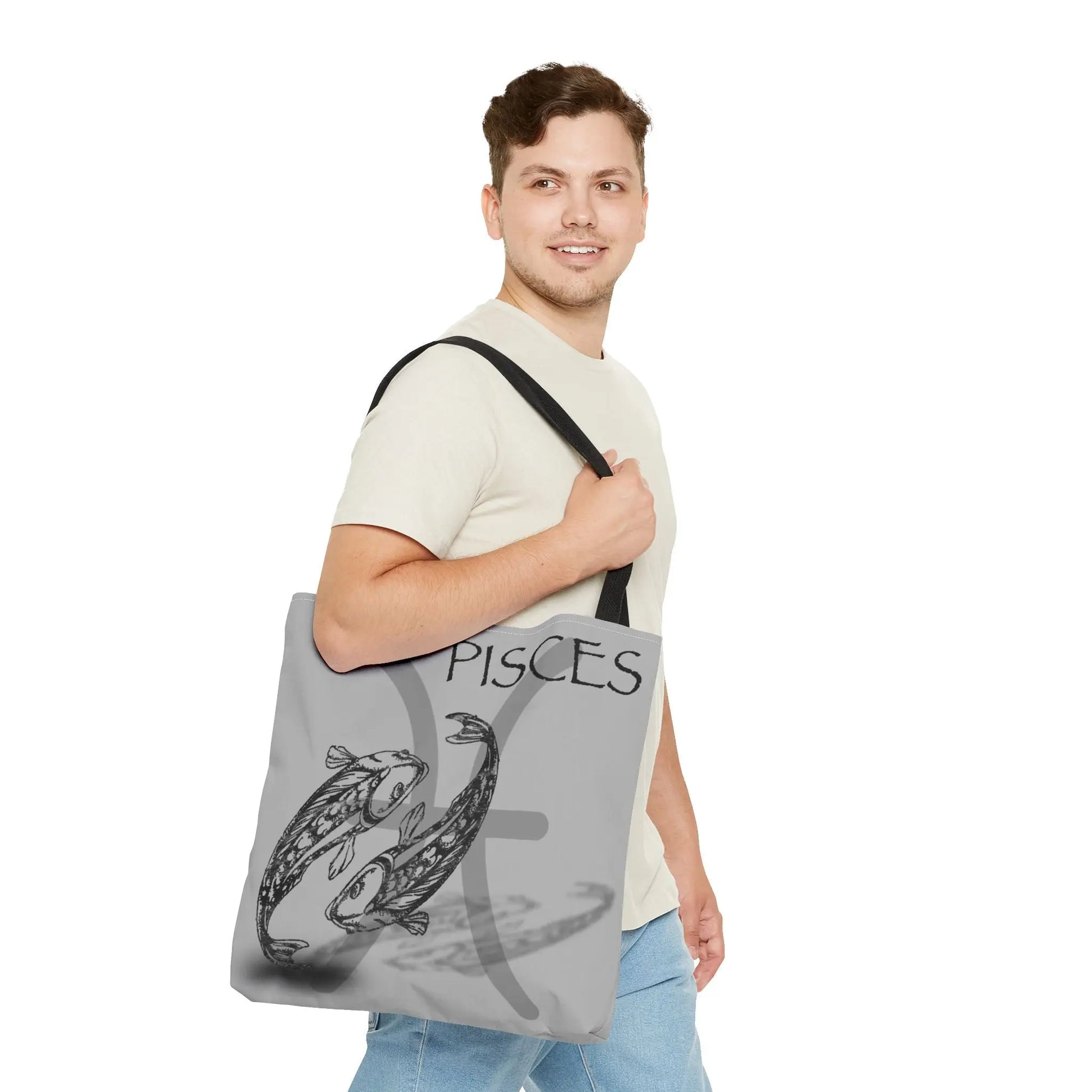 Man carrying the Pisces Zodiac Tote Bag to show scale and style.