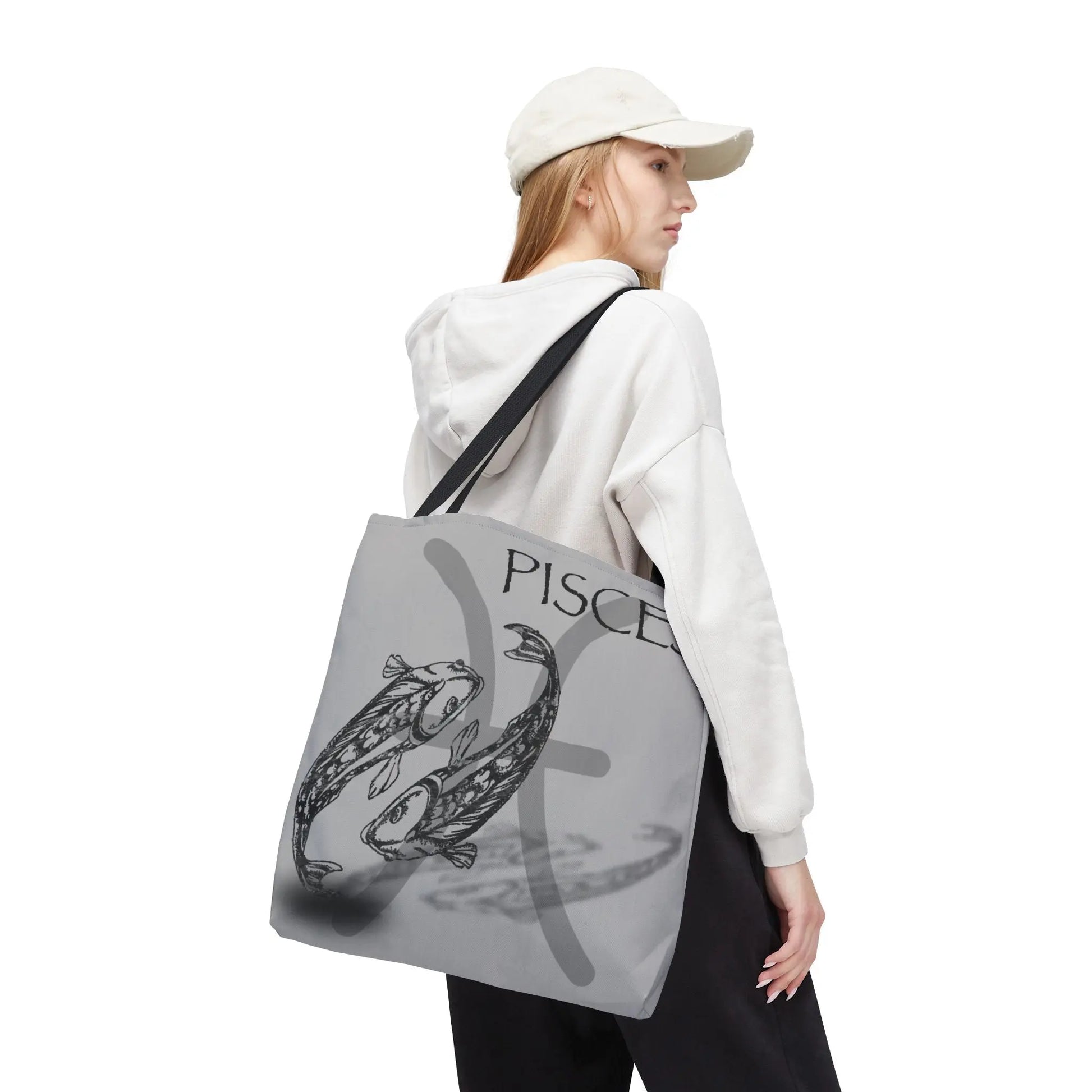 Woman carrying the Pisces Zodiac Tote Bag over her shoulder.