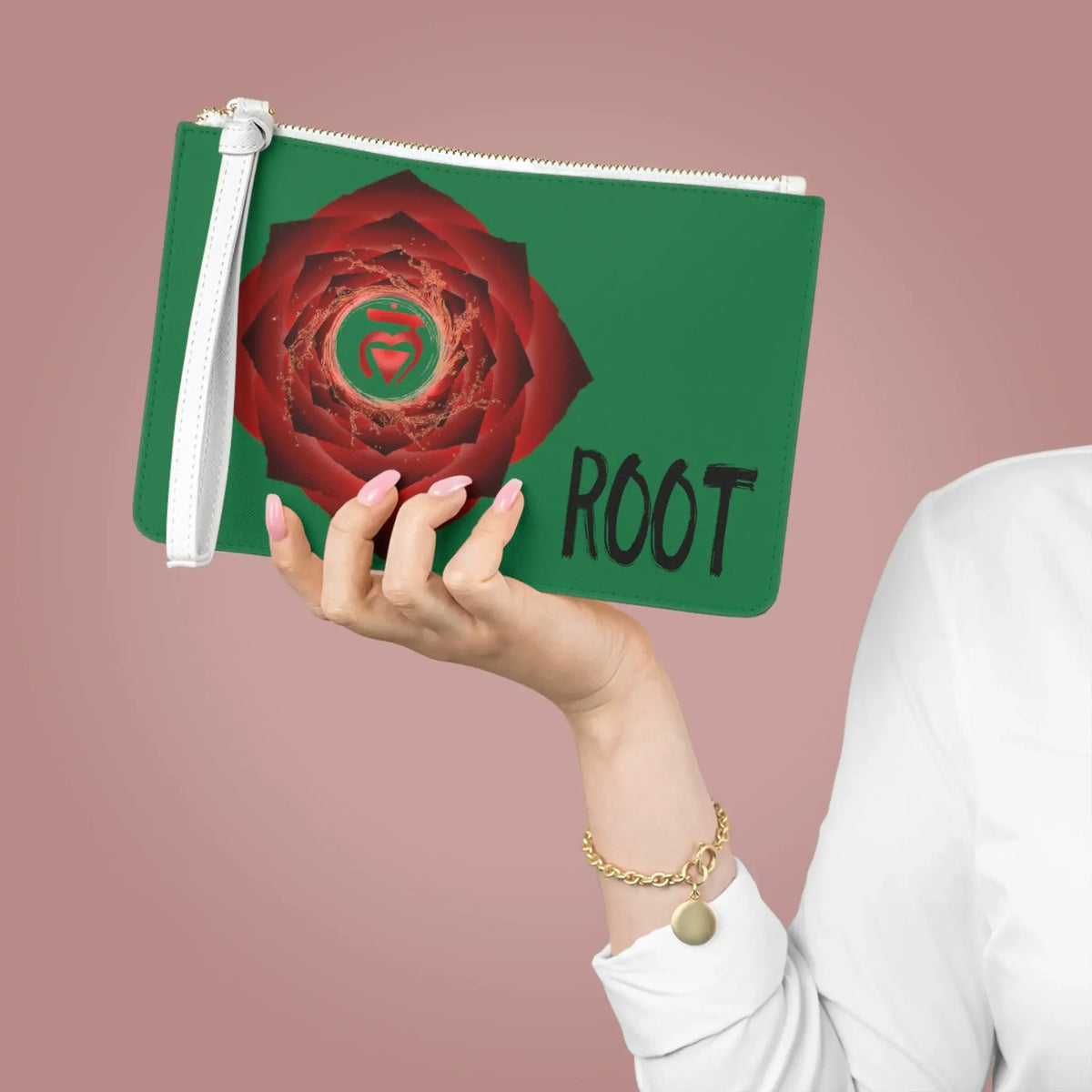 Green Root Chakra pouch with red rose design, held in hand for spiritual wellness and energy alignment.