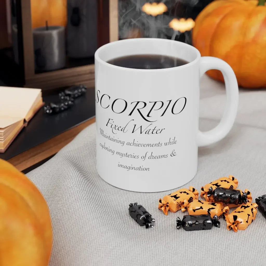 Scorpio astrology mug with 'Fixed Water' text, surrounded by Halloween candy and pumpkins