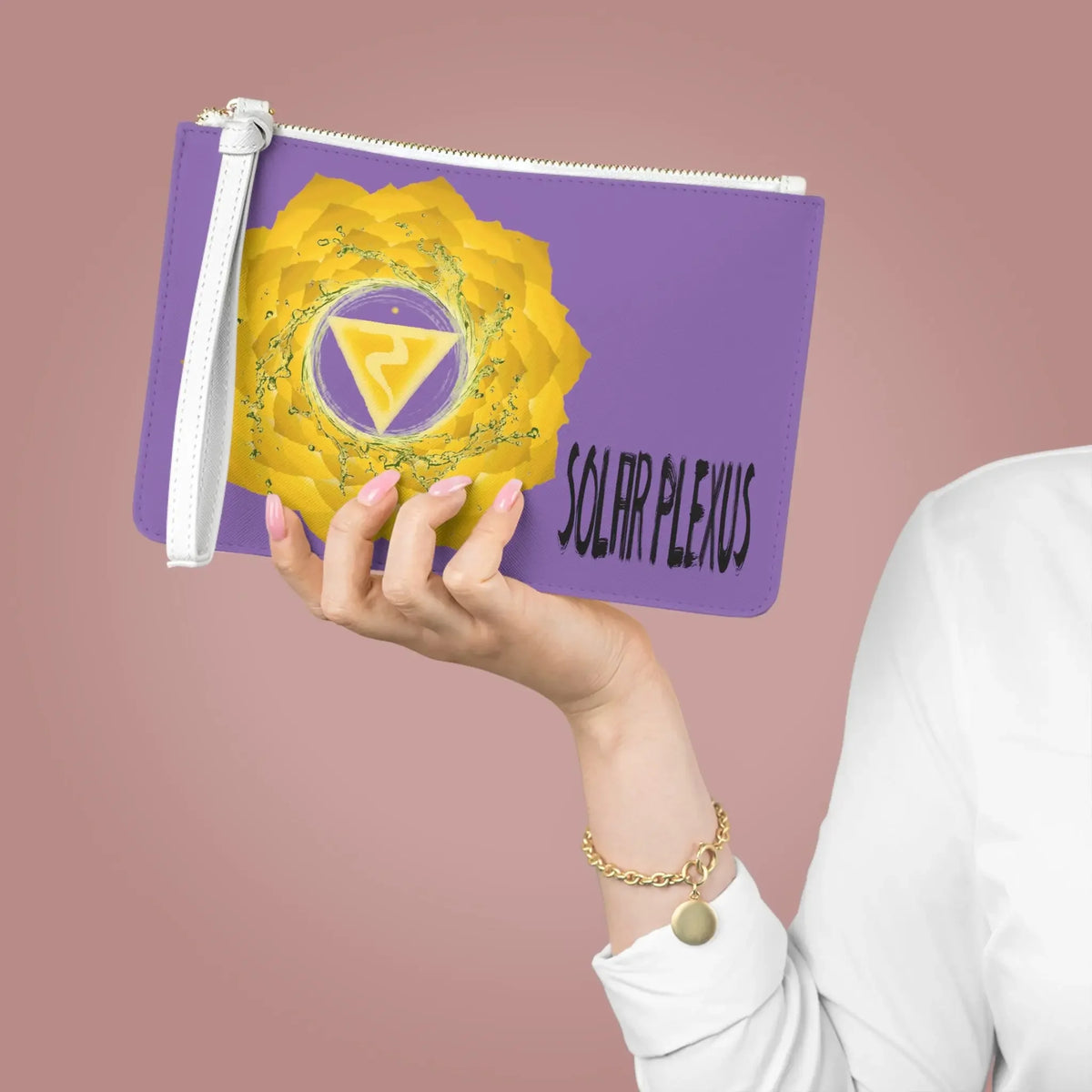 Purple Solar Plexus chakra pouch with yellow lotus design, held in hand for spiritual wellness.