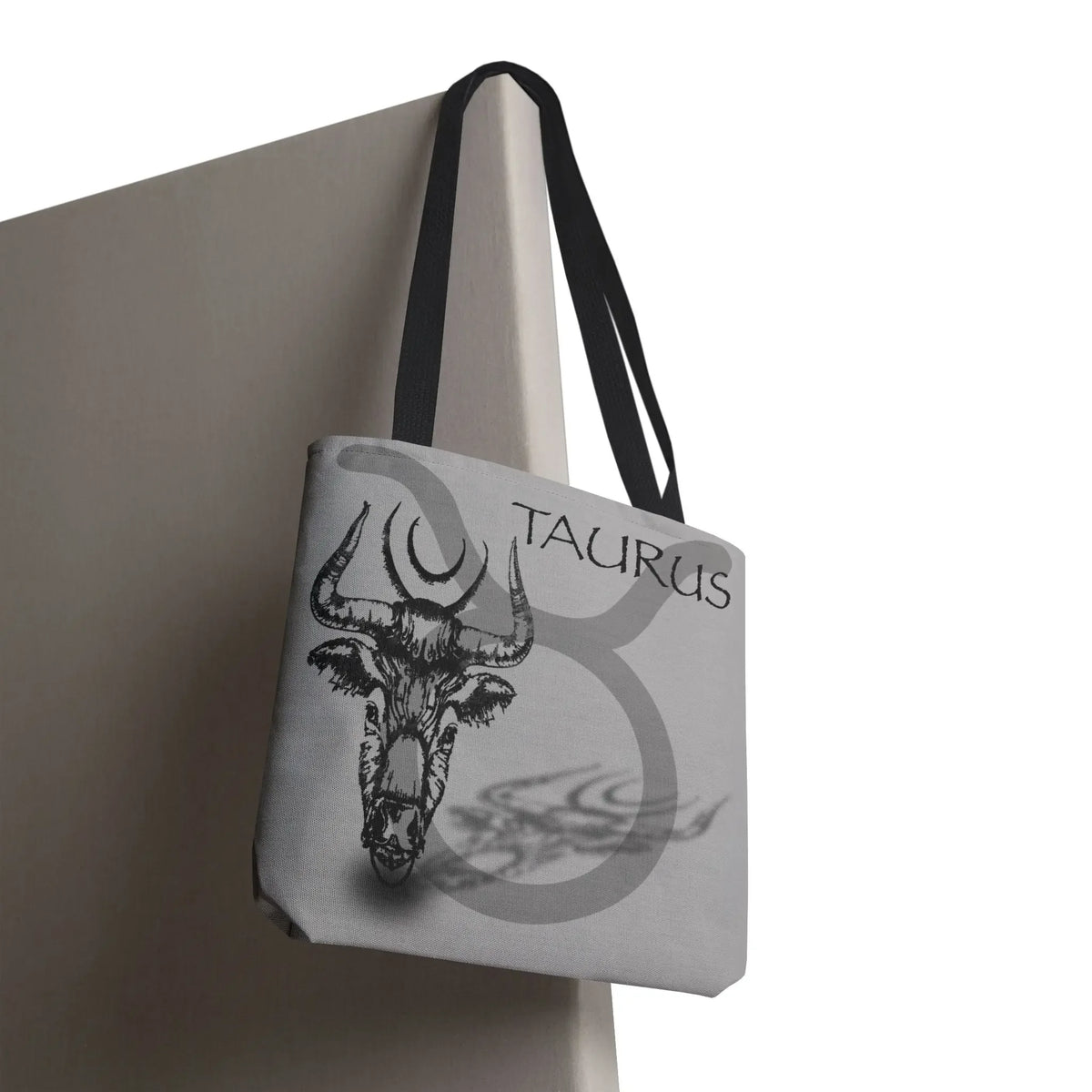Taurus zodiac tote bag with bull skull design, astrology-themed canvas shoulder bag