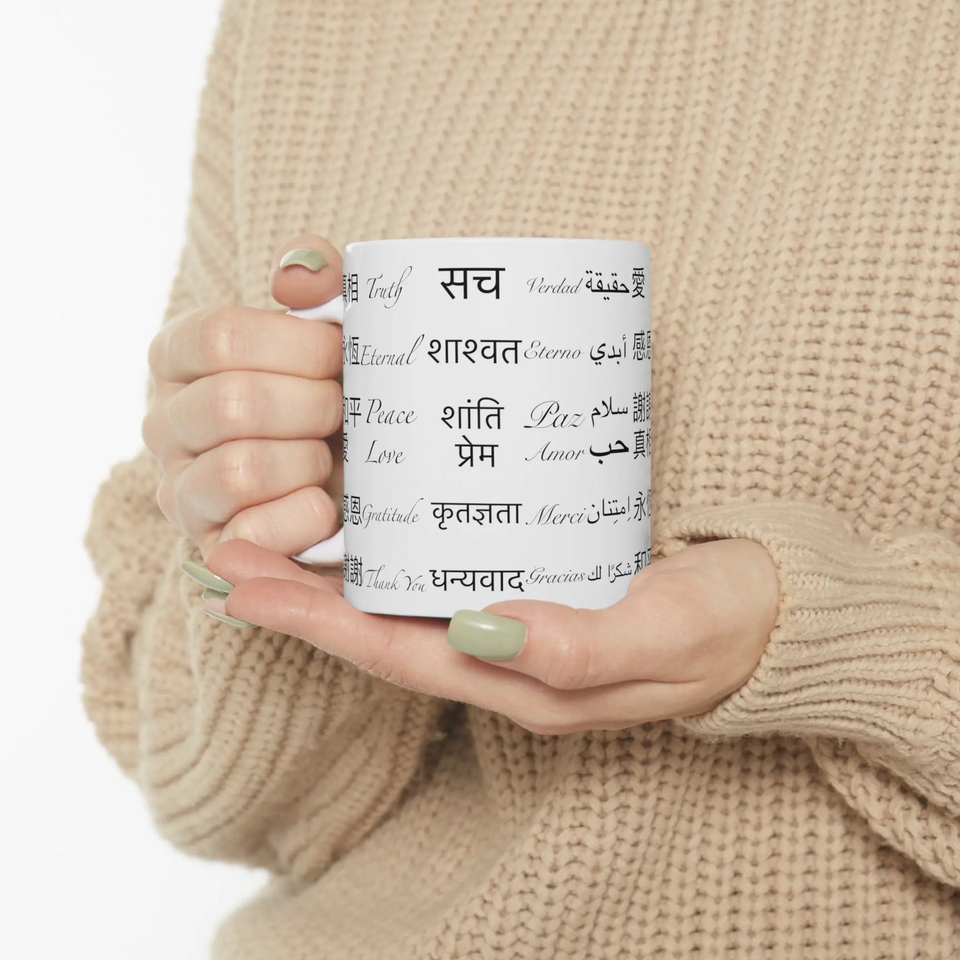 Person holding the Power of Words Mug to show scale and design.