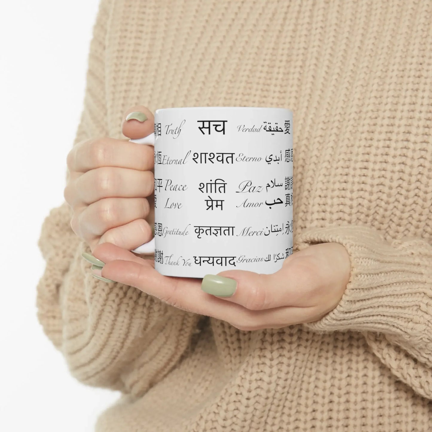 Person holding the Power of Words Mug to show scale and design.