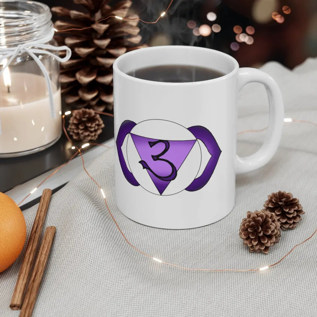 Third Eye Chakra Mug - Symbol side with a cozy, winter-themed background.