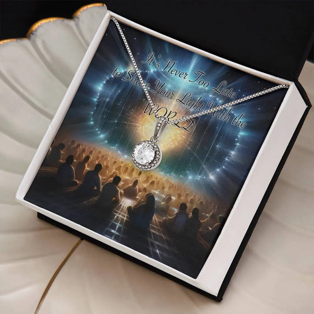 Timeless Brilliance necklace shown in the standard box with "Share Your Light" message card.