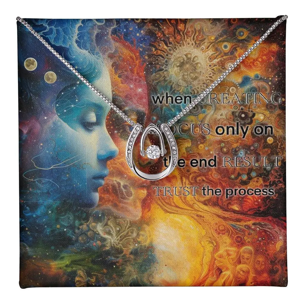 Close-up of the "Trust the Process" cubic zirconia pendant.