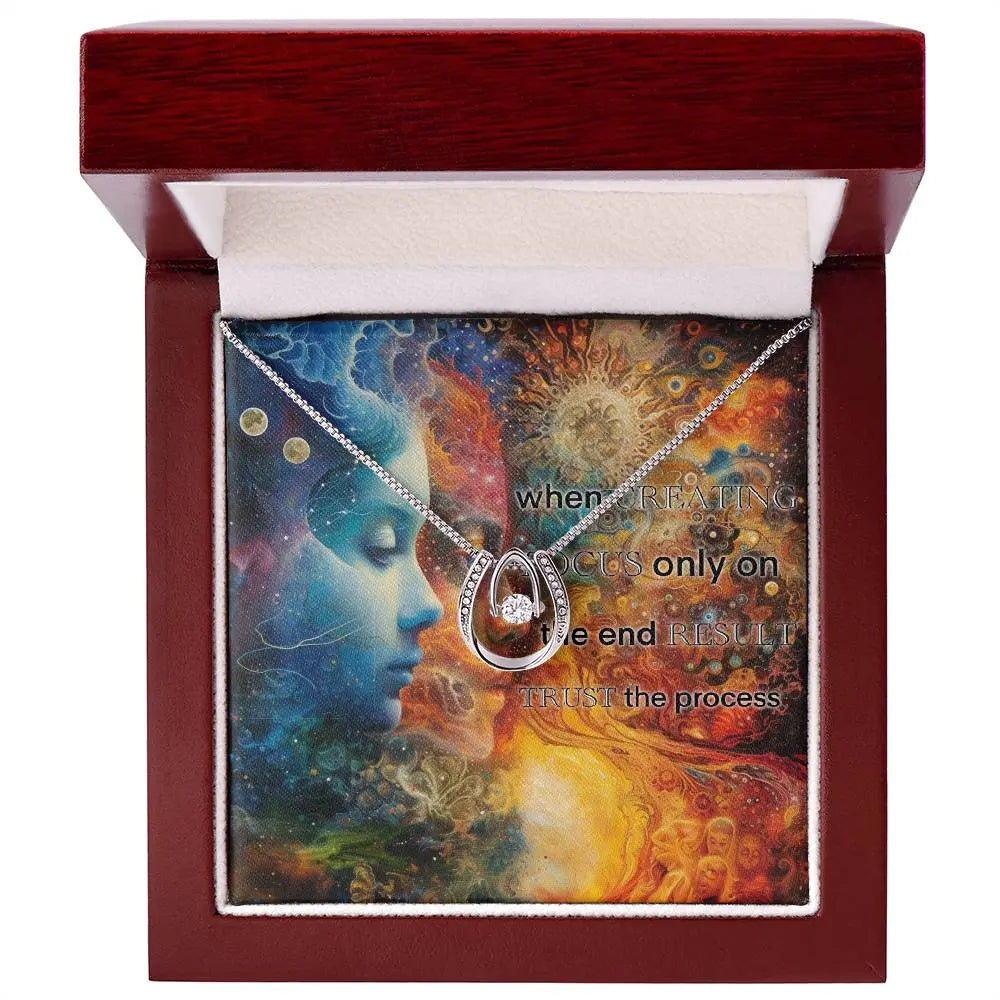 "Trust the Process" necklace shown in the luxury box with its message card.