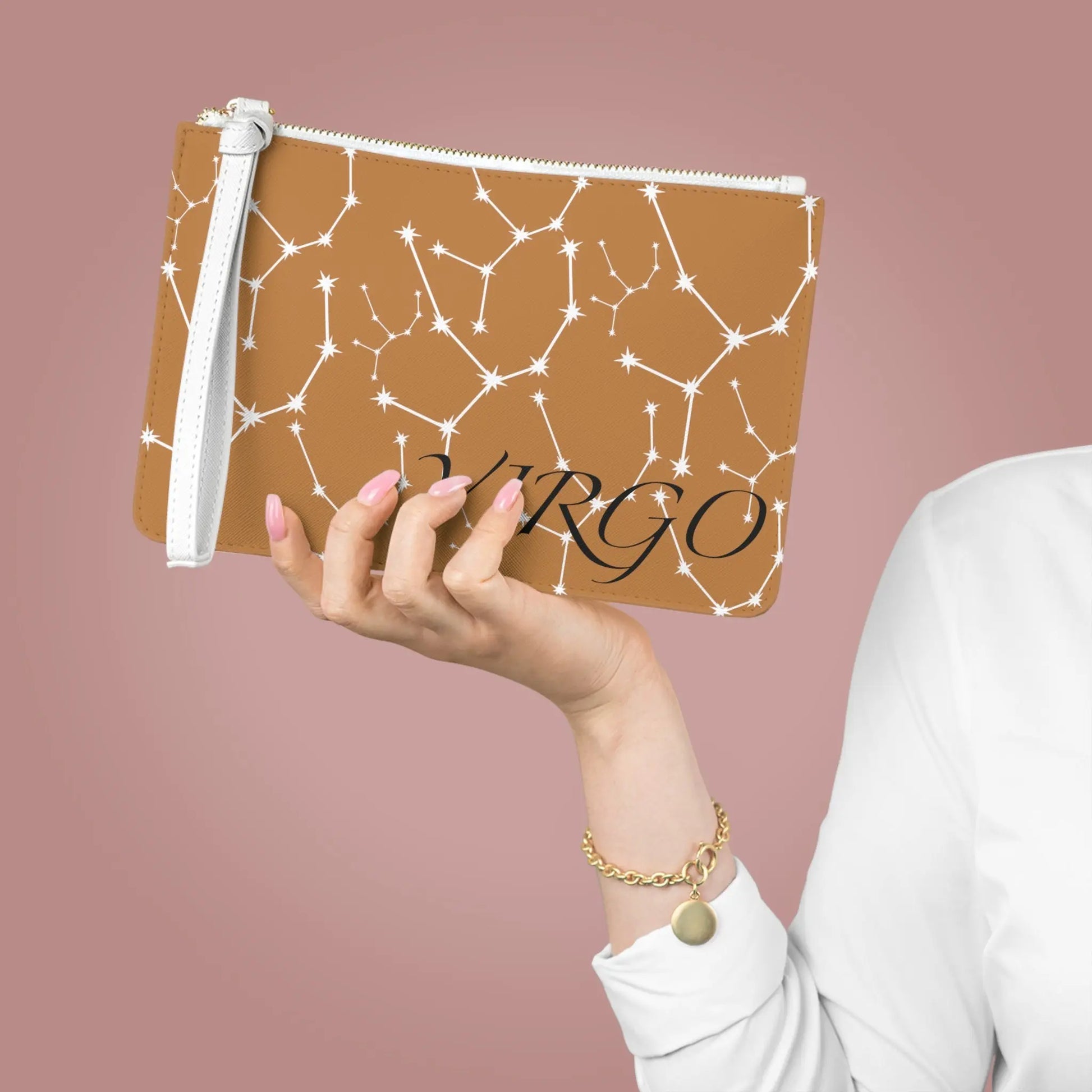 Large Virgo Zodiac Clutch held by a woman to show its scale.