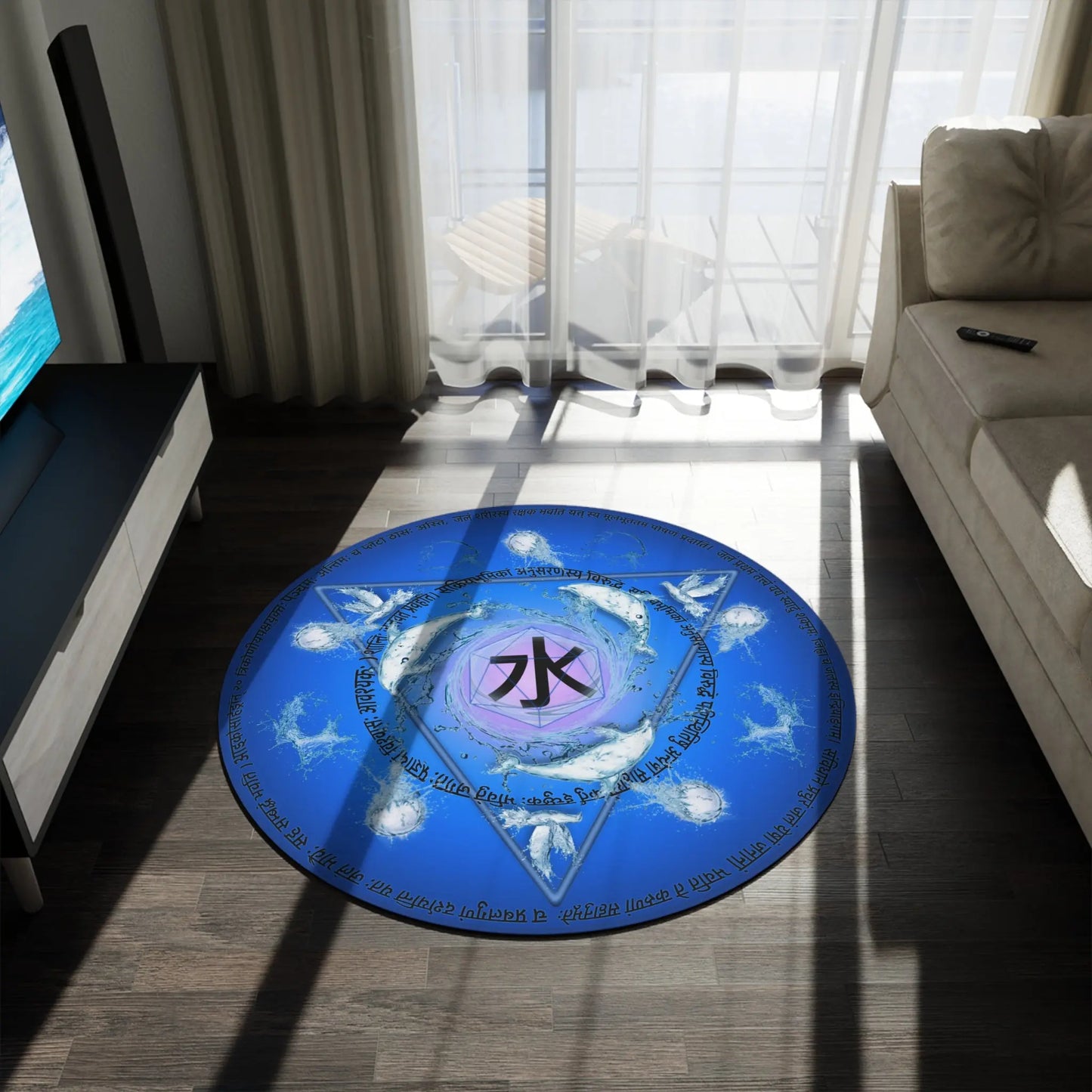 The 60x60" "Water Element" Rug shown in a modern living room next to a sofa.