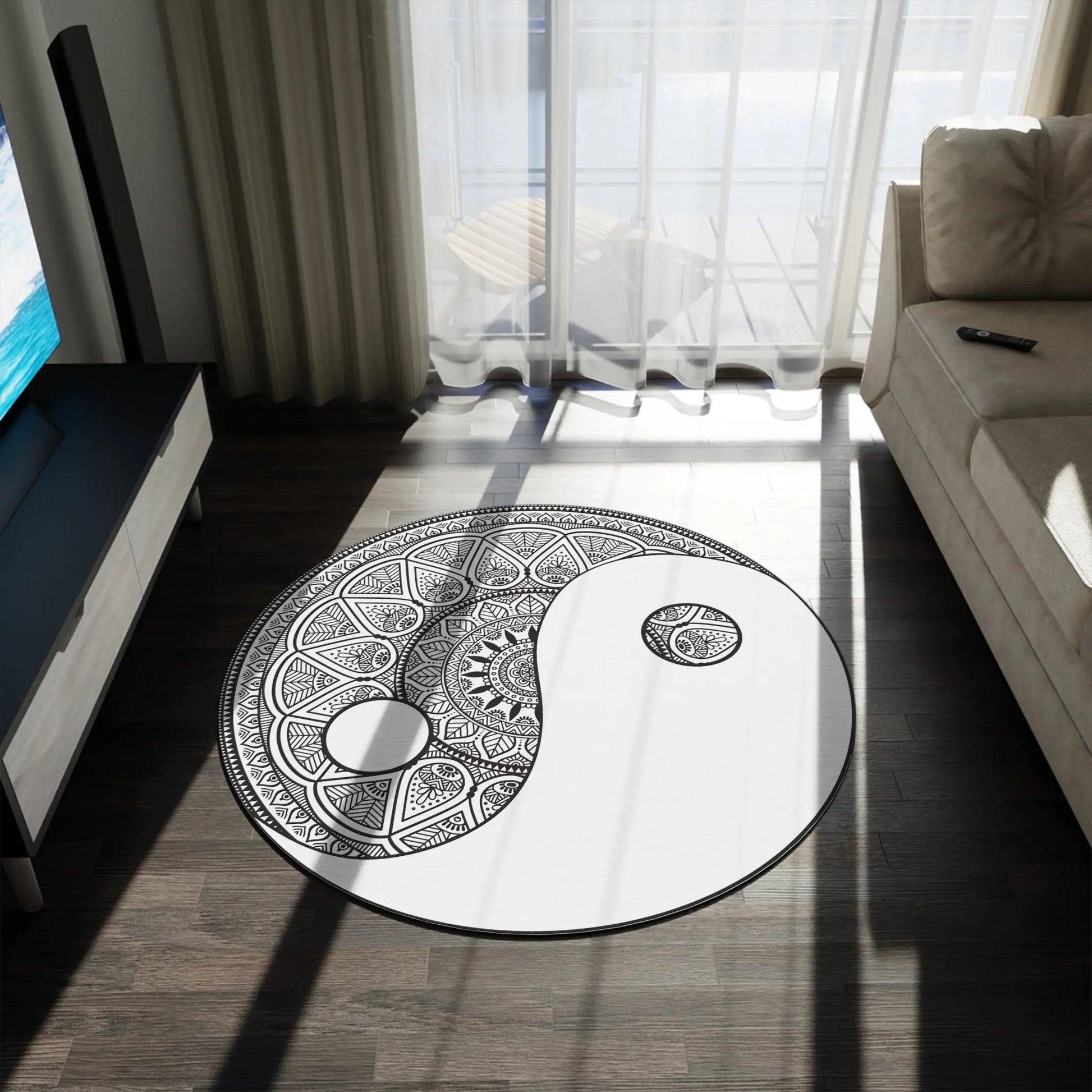 The 60x60" "Yin Yang Mandala" Rug shown in a modern living room next to a sofa.