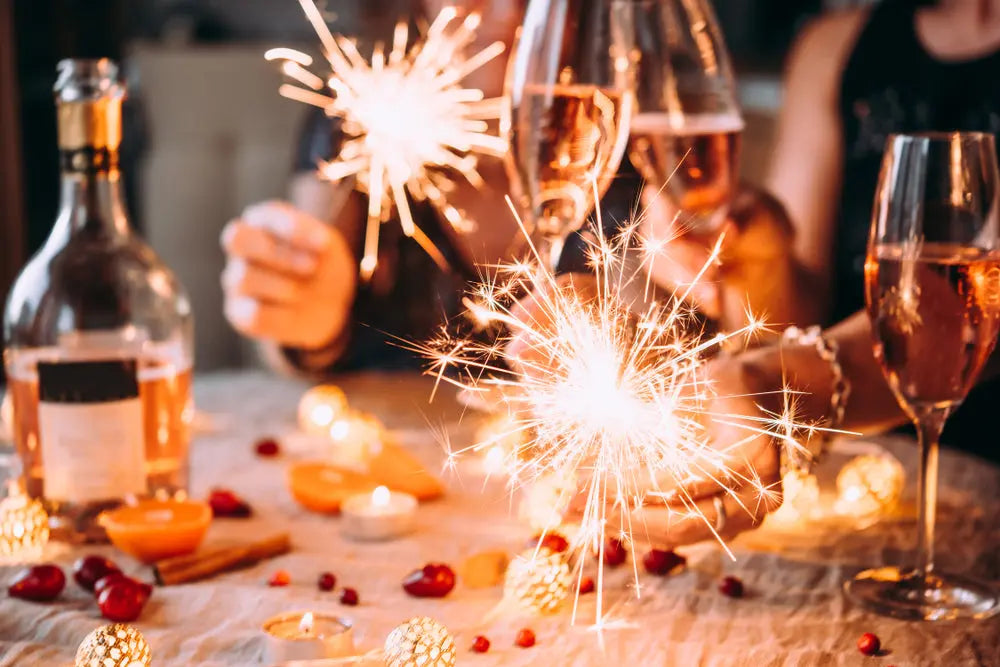 Celebration with sparkling wine, sparklers, and festive table decor for joyful gatherings