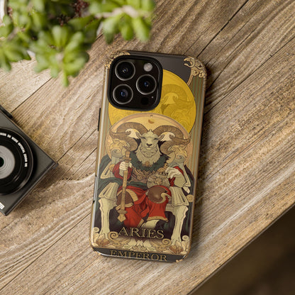 The Aries Tarot Card case resting on a wooden table next to a camera and a plant.