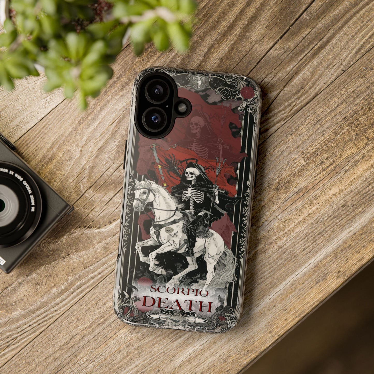 Scorpio "Death" Tarot Card Phone Case on a wooden table
