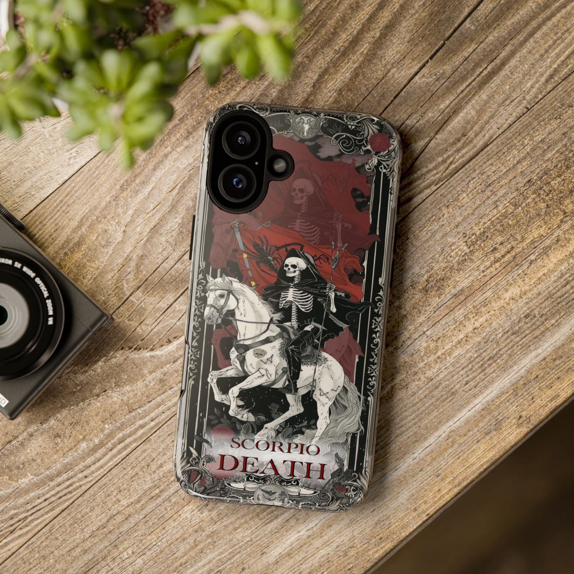 Scorpio "Death" Tarot Card Phone Case on a wooden table